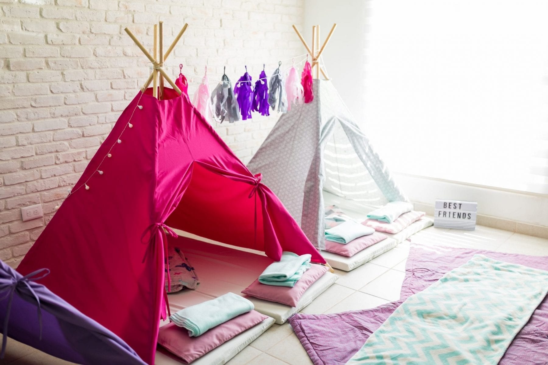 Pink and white teepee tents for kids party at home