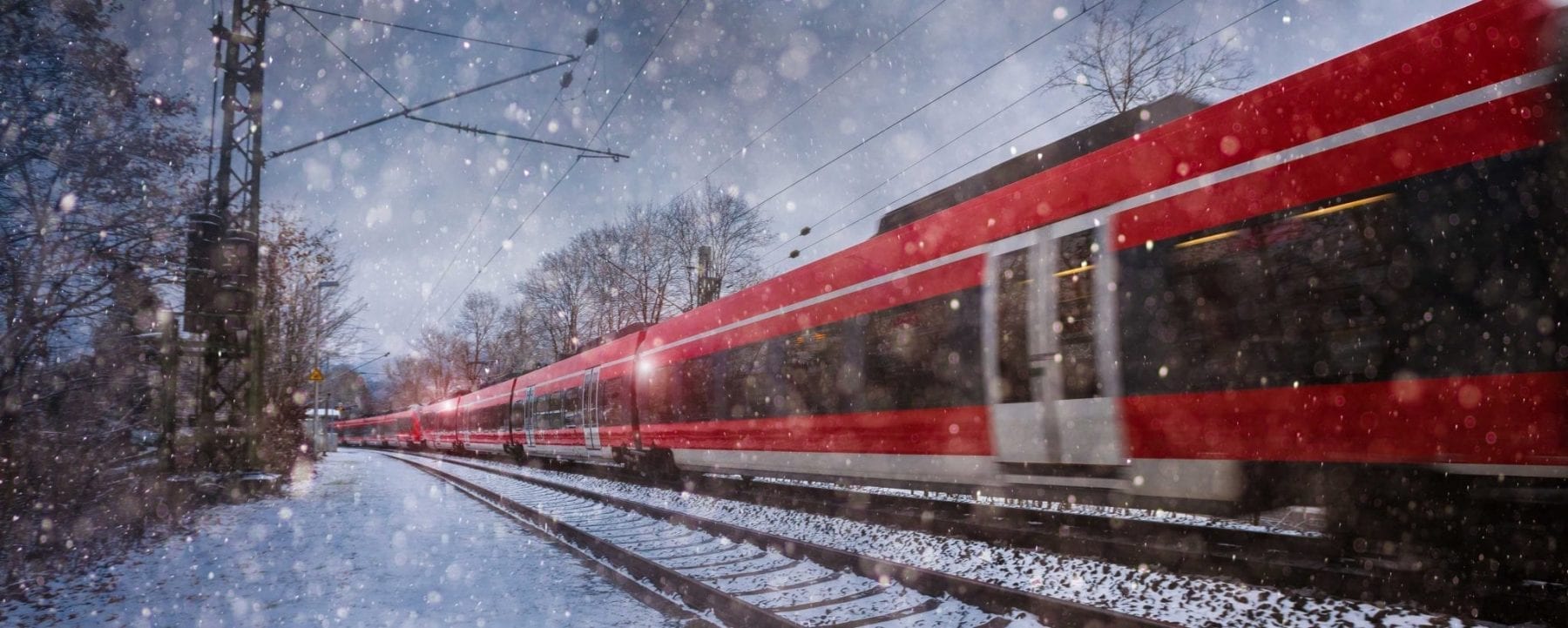 Train going through the snow