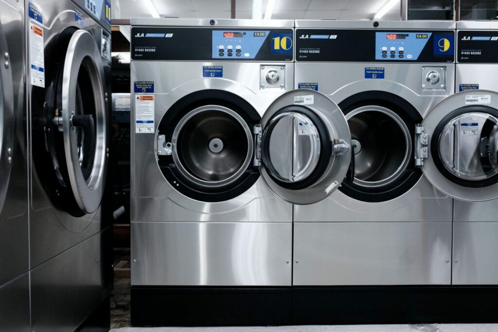 A group of drying machines at a laundromat that can be used to deal with bed bug infestations.